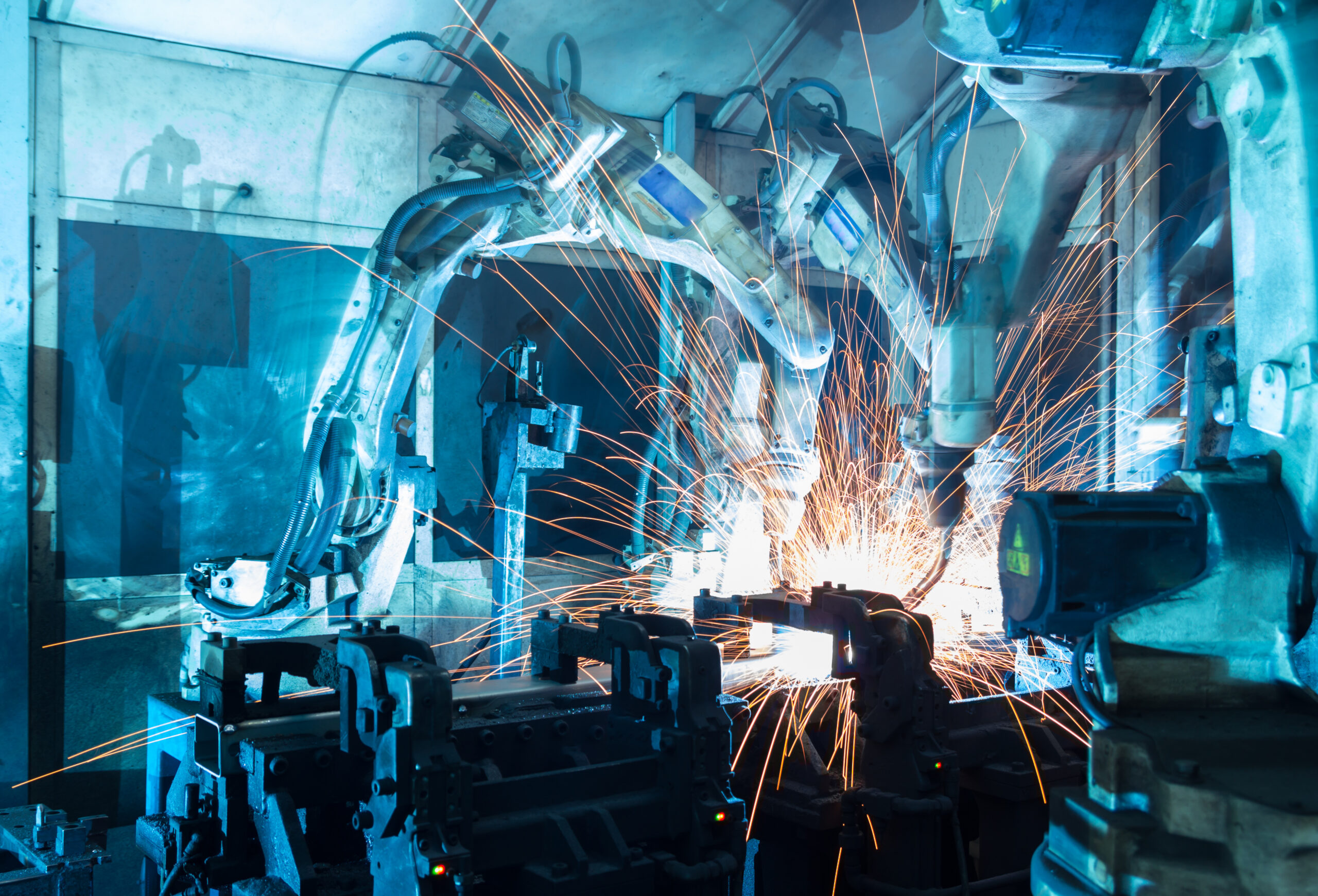 A robot is working on a machine in a factory.