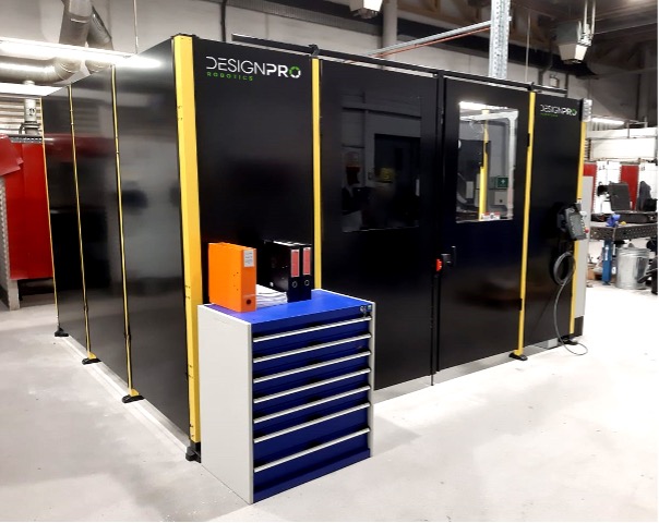 A black and yellow machine in a factory.